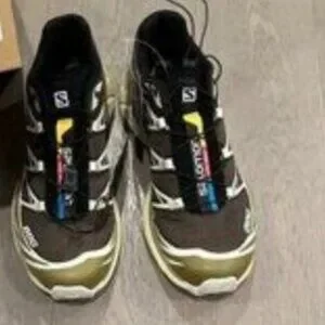 Salomon Black and Gold Sneakers